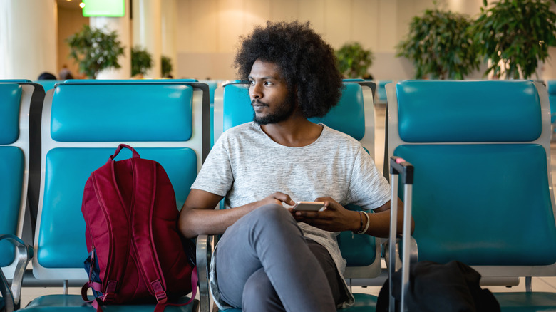 Man waiting at airport gate