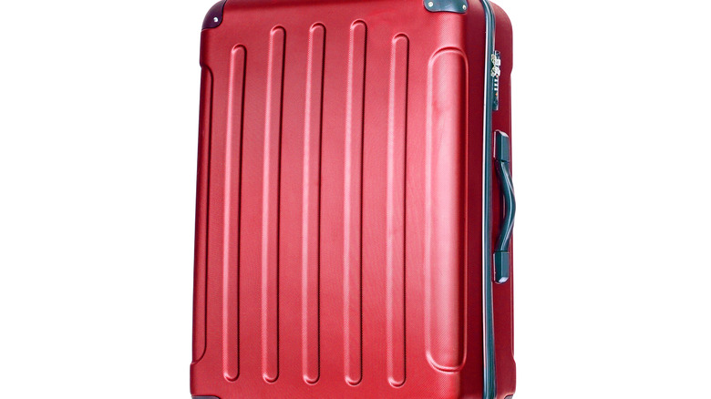 A red zipperless suitcase