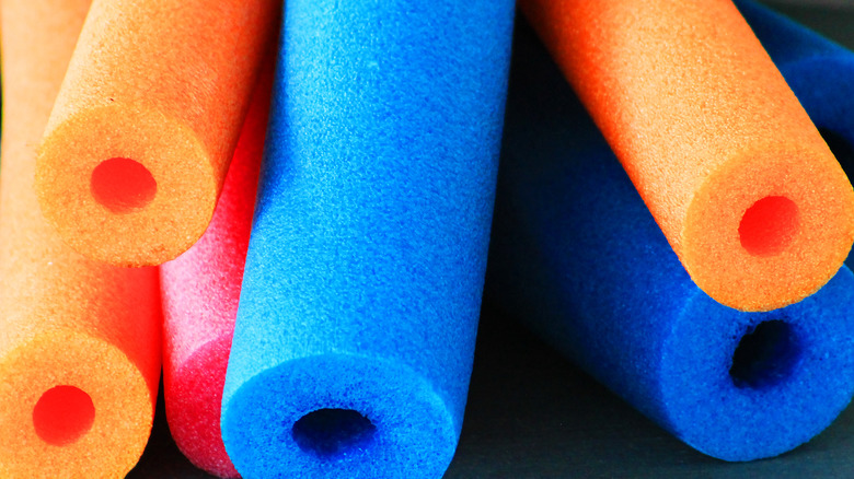 blue and orange pool noodles