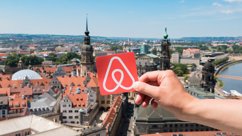 Airbnb symbol over city