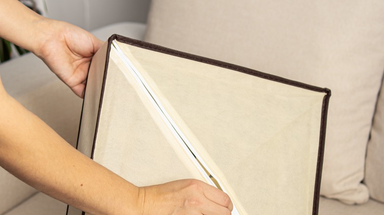 Person holding a closet organizer