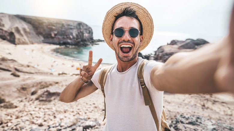 man taking selfie at beach