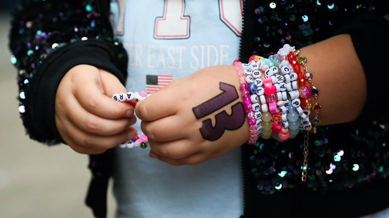 Fan wearing friendship bracelets