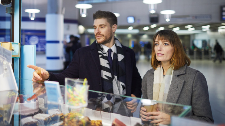 Travelers at airport food counter