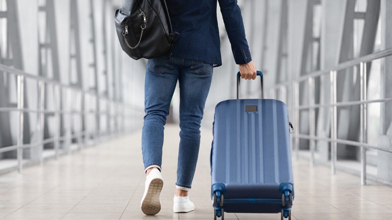 passenger rolling blue suitcase