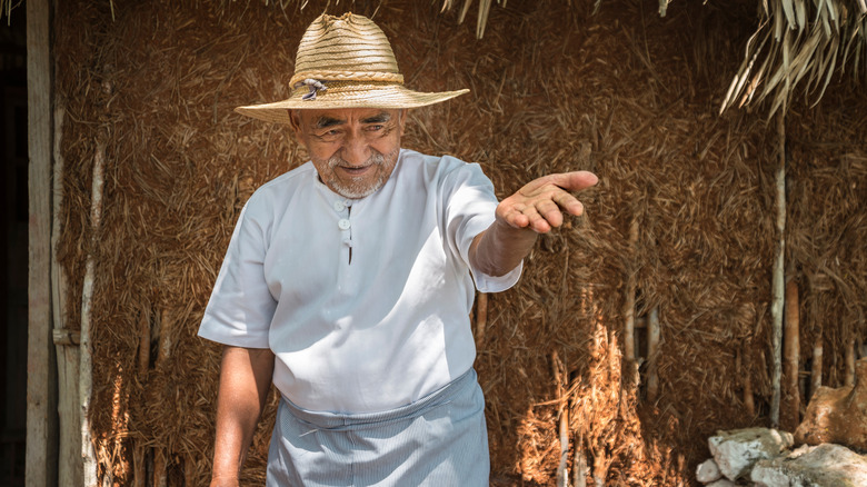 Mayan farmer greeting visitors