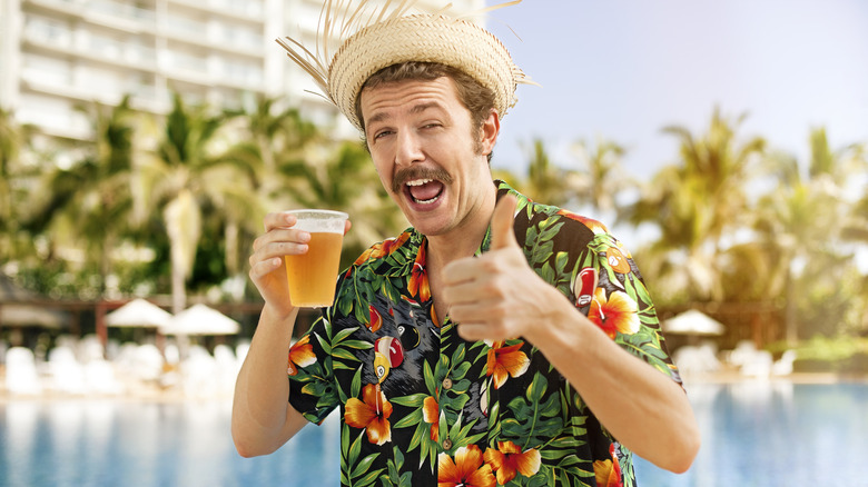 Man drinking at a resort