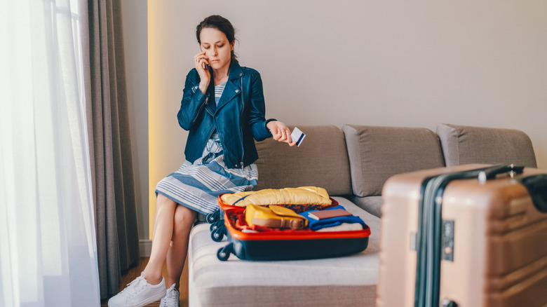 stressed traveler making call