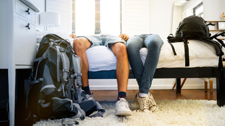 sleeping travelers on bed