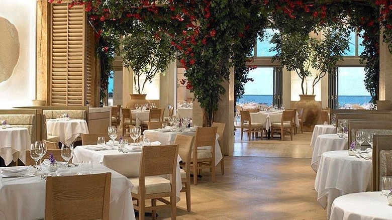 dining room with chairs and ocean view