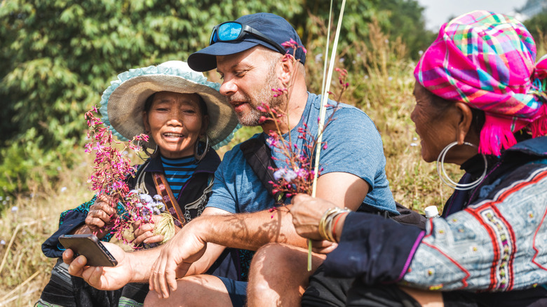 Male tourist with local women