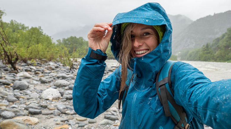 Hiker smiling in the rain