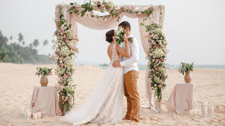 couple getting married on beach