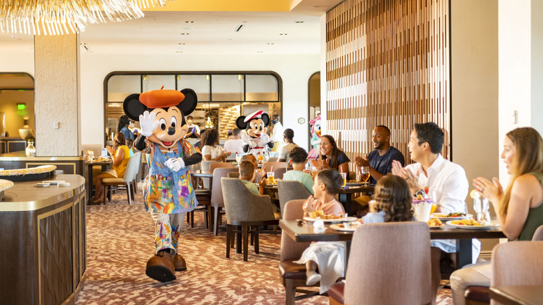 family dining with Mickey Mouse 