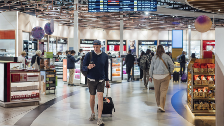 Man walking in airport store