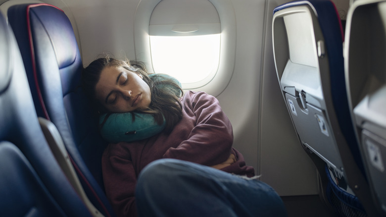 Woman sleeping on airplane