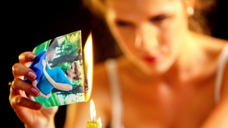 woman burning photos