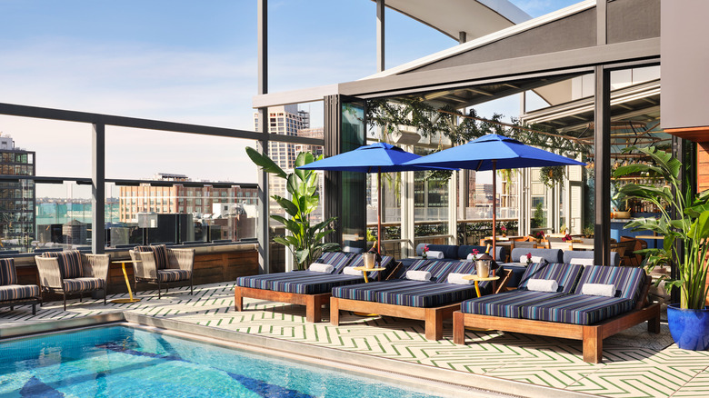 Three daybeds at rooftop pool