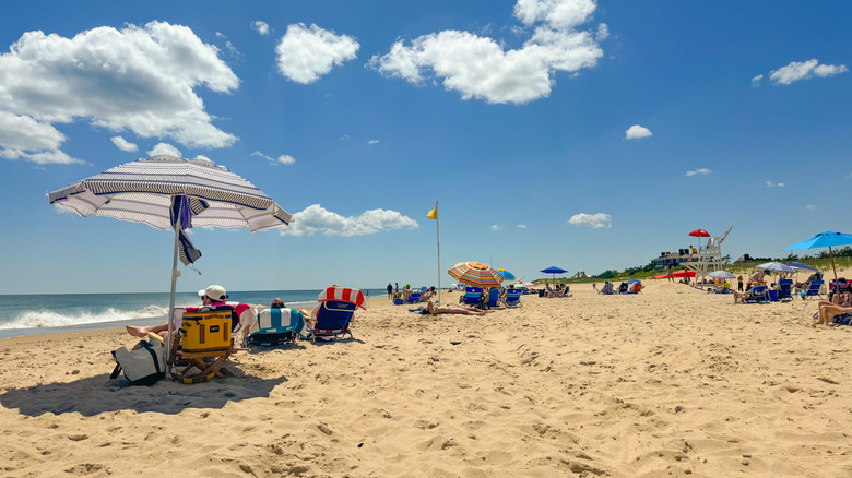 Visitors sunbathe in Ocean Beach, New York.