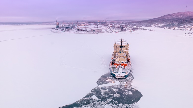Small ship navigating through ice