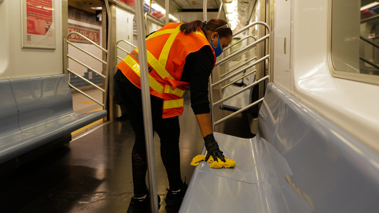 Contractor cleaning NYC subway car