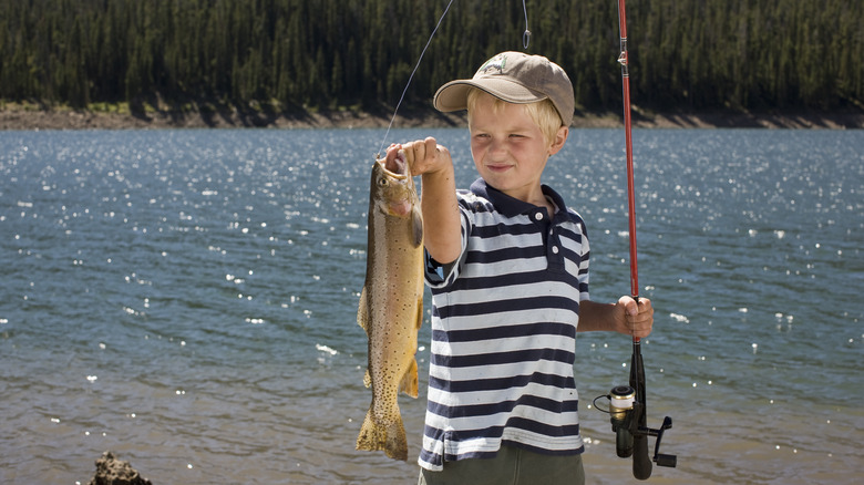 boy holding a fishing pole