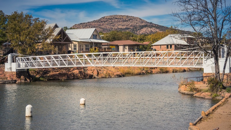 A footbridge spans Medicine Creek