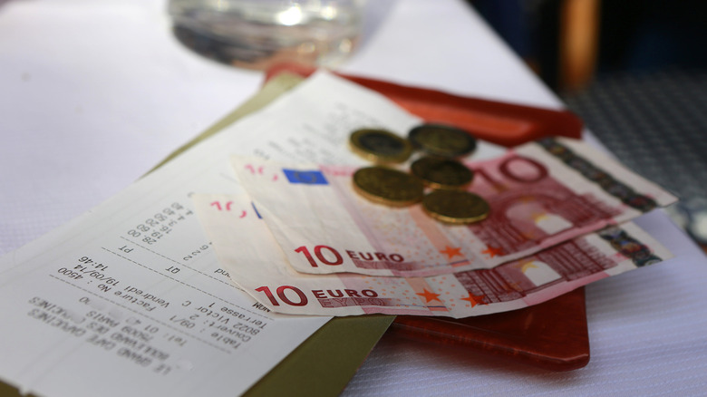 Euro coins and bills on a table