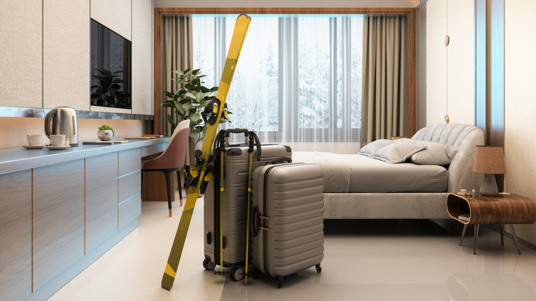 Skis and bags in a hotel room