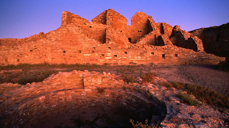 stone desert buildings at sunset