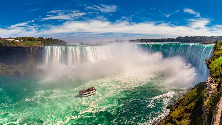 waterfall with boat approaching