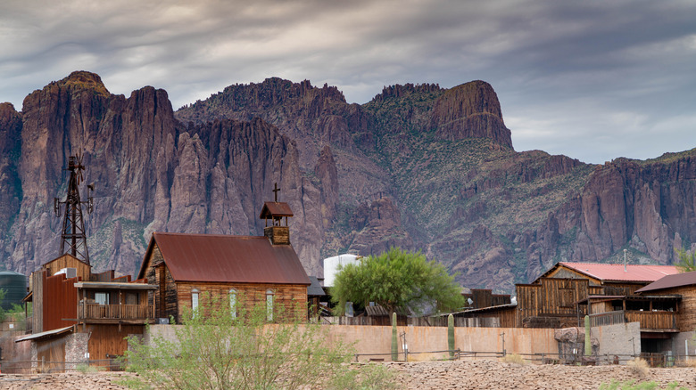 Wood buildings beneath Superstition Mountains