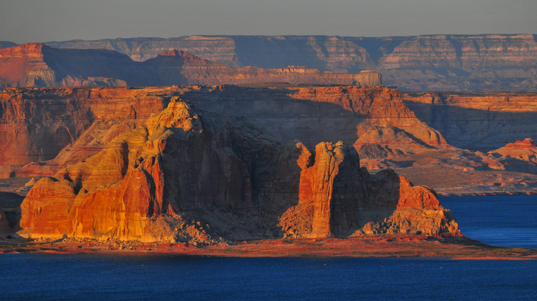 red rock formations and lake