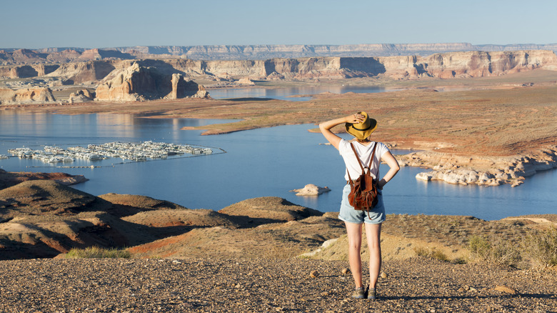 A woman looking out onto a desert lake in Arizona