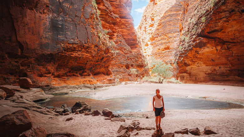 woman surrounded by red rocks