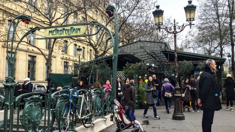 A sign for the Metro in Paris