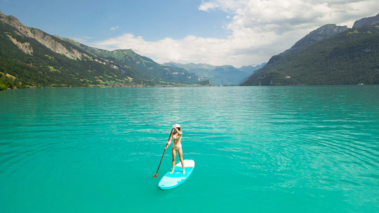 Woman paddleboarding on Lake Brienz