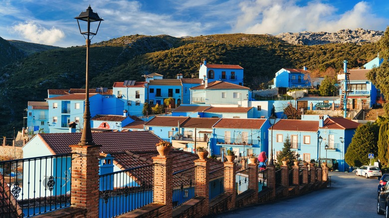 blue buildings in the mountains
