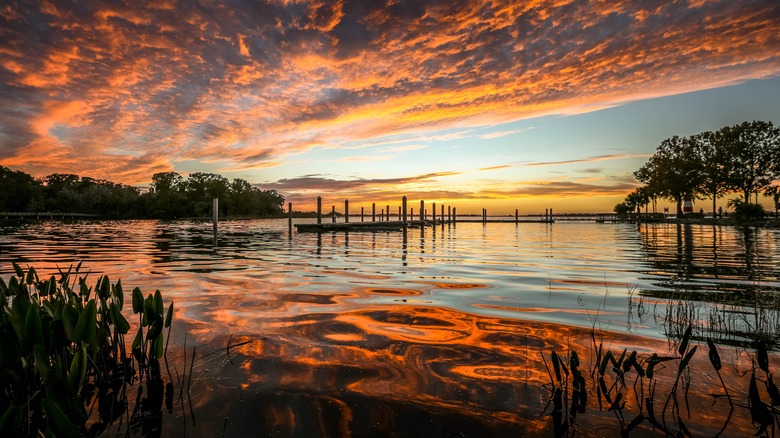 Sun setting over pier on Lake Dora