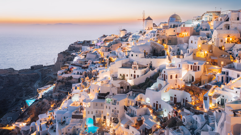 whitewashed village spilling down cliff