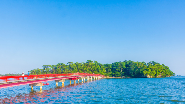 Fukuura Island's red bridge over water to an island