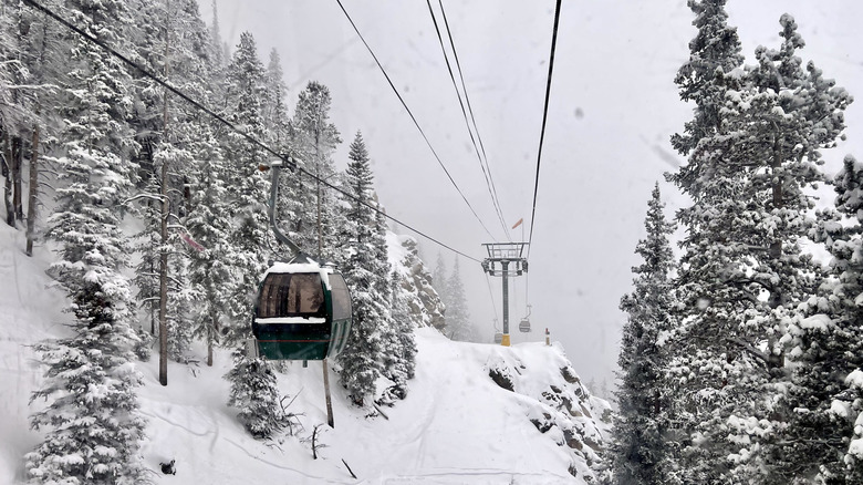 Gondola ride in Palisades Tahoe during a snowy day