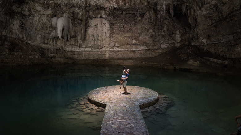 loving couple in cenote