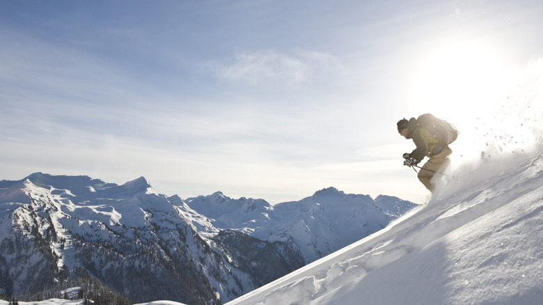 solo skier descends backcountry terrain in Revelstoke B.C.