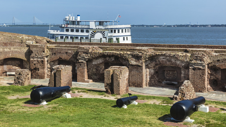 brick wall, ferry boat, cannons