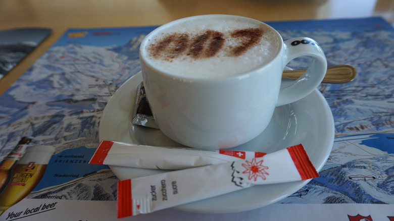 A cappuccino is adorned with the 007 logo in cinnamon