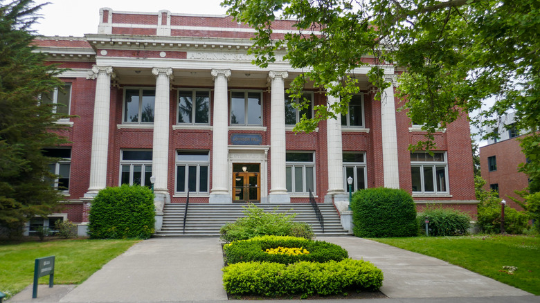 building with pillars and landscaping