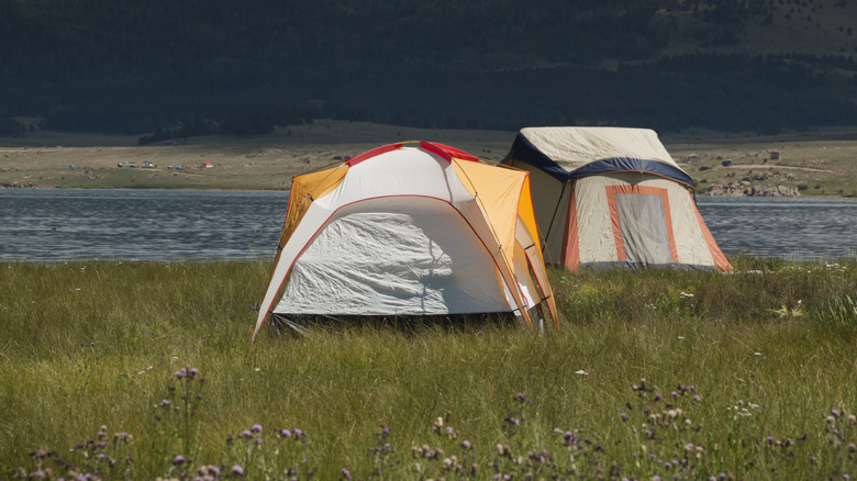 colorful tents near lake 