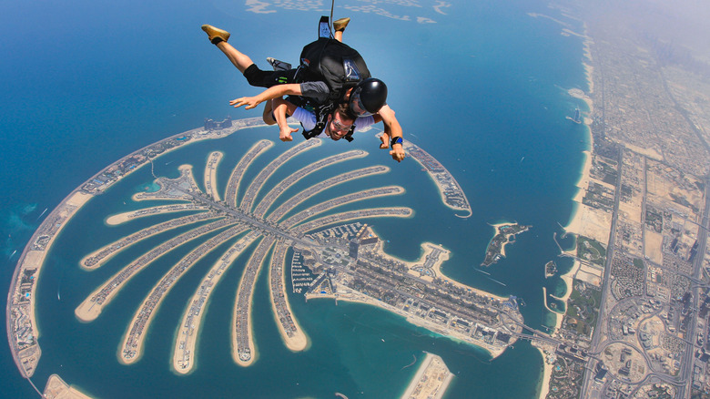 skydiver over Palm Jumeirah islands of Dubai