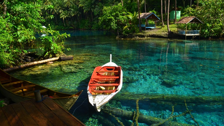 Boat and huts around lake